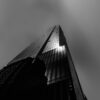 Beautiful low angle shot of a tall skyscraper in black and white