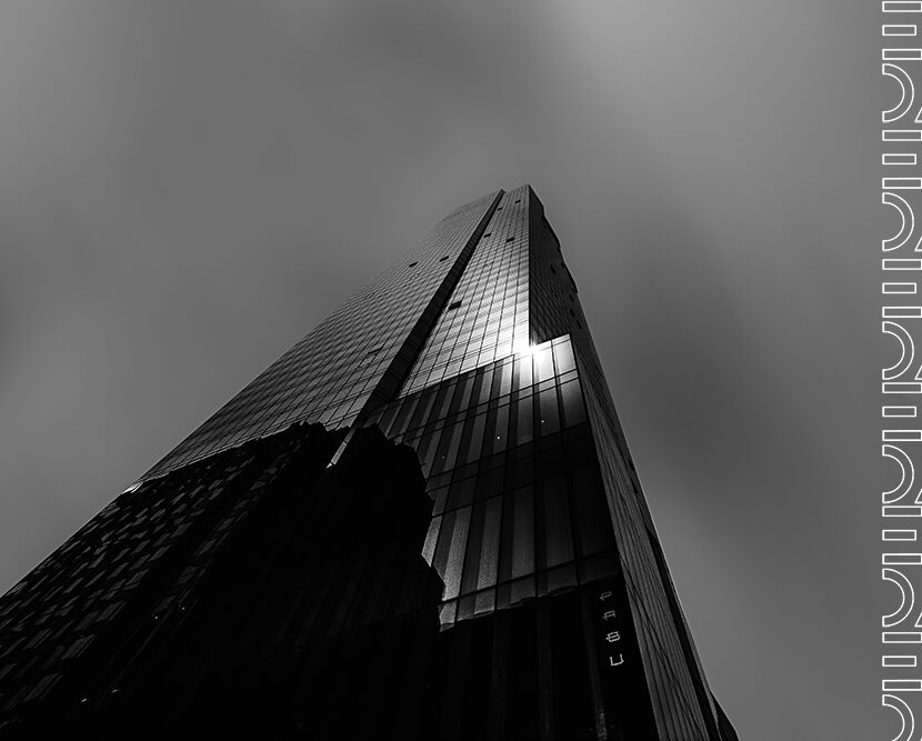 Beautiful low angle shot of a tall skyscraper in black and white